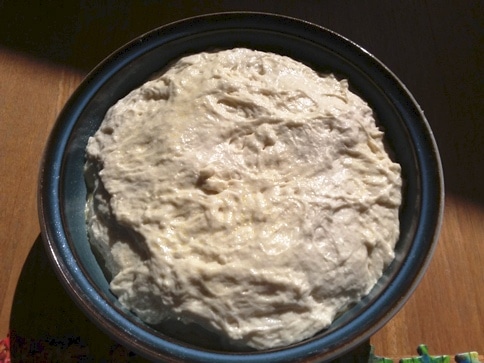 peasant bread in baking dish before second rise